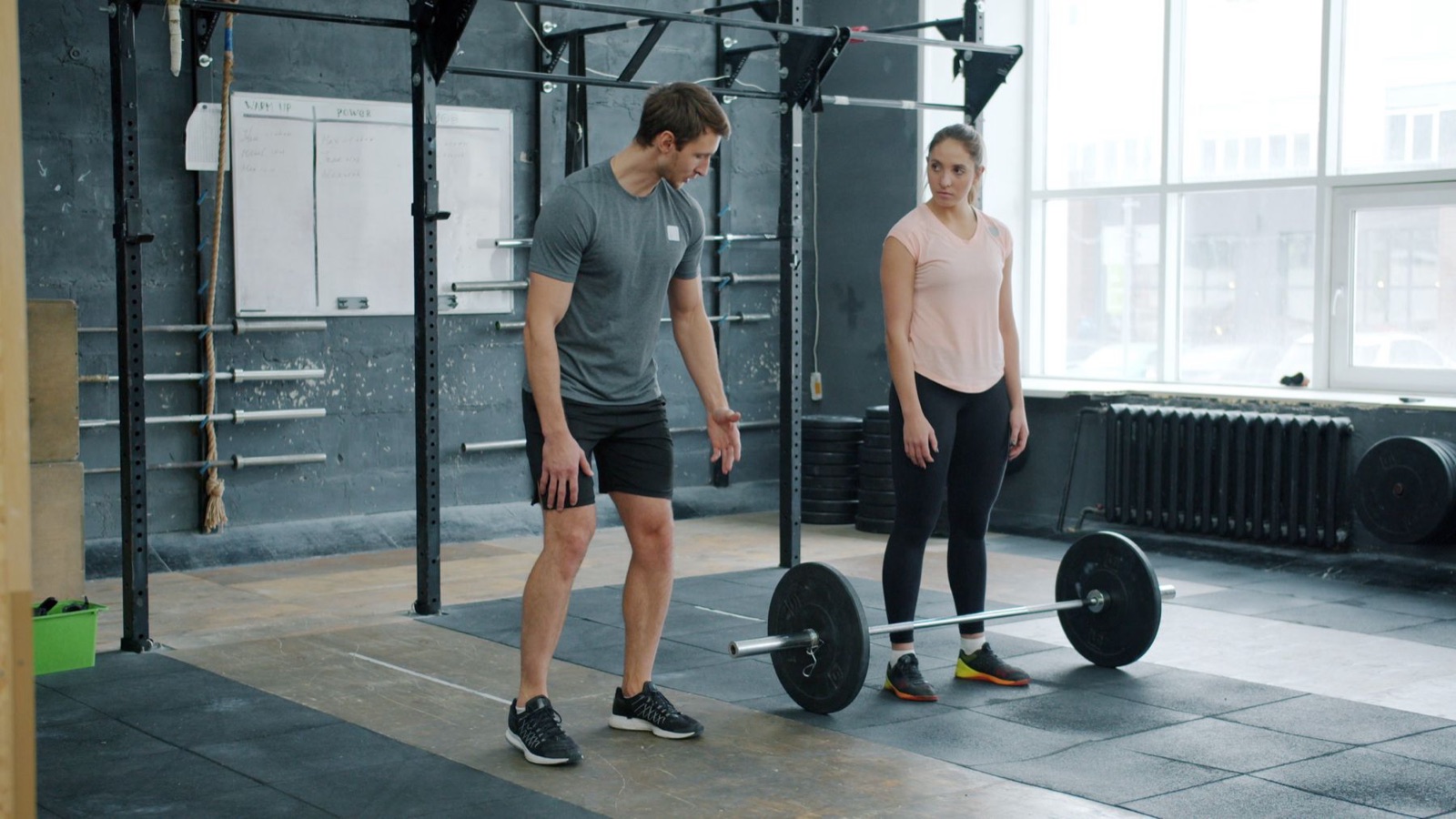 A trainer working with a client